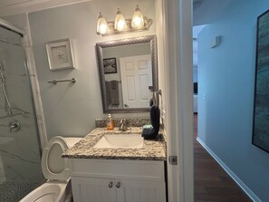 Shower, hair dryer, towels, soap