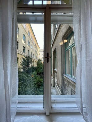 Stroll through a charming, tree-lined street with historic buildings and picturesque views.