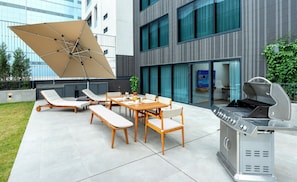 Enjoy al fresco dining on the patio with a stainless steel grill and comfortable seating for six.