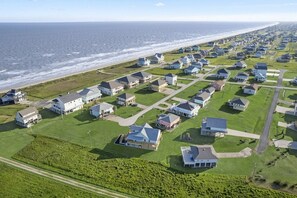 Coastal homes line the grid-patterned streets, offering ocean views from their two-story structures.