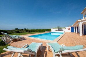 A pool area with lounge chairs and a clear view of the surrounding landscape. - Vila OceanBreeze Aljezur 4 Bdrms10 Px Heated Pool Spacious & Cozy, Sea & Nature (Aljezur)