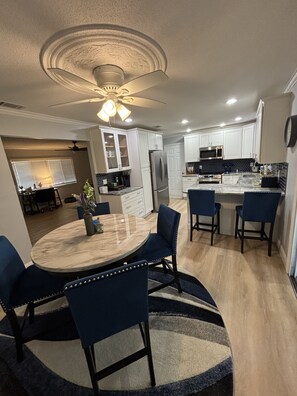 Enjoy meals in the kitchen with a dining area and large island.