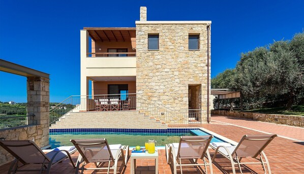 A modern two-story building with a stone facade, a swimming pool, and outdoor seating. - Villa 'Margarita's 3' with Sea View, Wi-Fi and Air Conditioning (Chania)