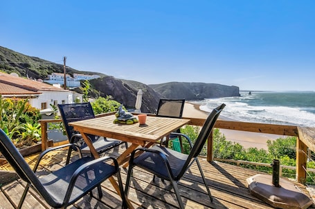 Outdoor dining. Holiday Home 'Abrigo Do Pescador' with Sea View, Private Terrace and Wi-Fi