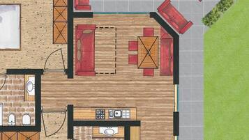 Een plattegrond van een huis met een keuken, een eethoek, twee slaapkamers, een badkamer en een klein terras.
