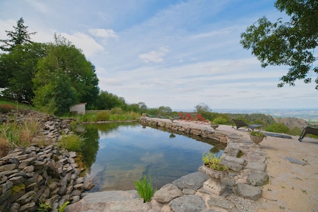 Property grounds. Holiday Home 'Charmante Et Élégante Ferme Rénovée' with Lake View, Shared Pool and Wi-Fi