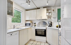 Fridge, stovetop, dishwasher, coffee/tea maker