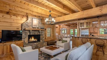 Smart TV, fireplace, books, computer monitors