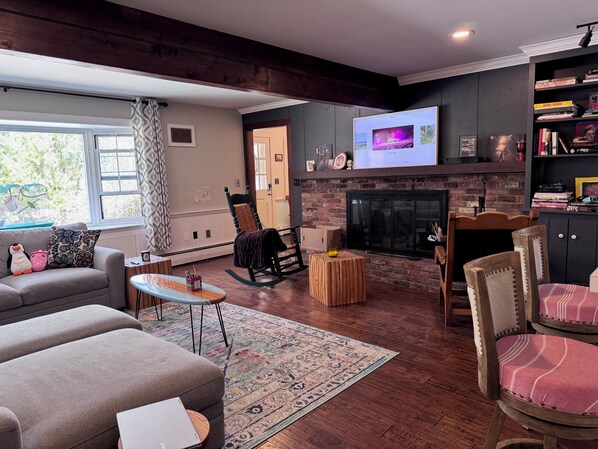 Smart TV, fireplace, books