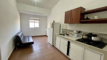 Deluxe Apartment | Private kitchen | Fridge, coffee grinder