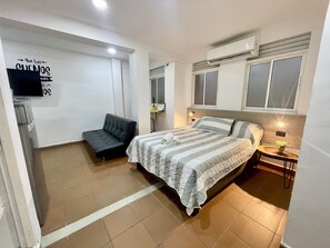Habitación Deluxe | 1 habitación, tabla de planchar con plancha, wifi gratis y ropa de cama 