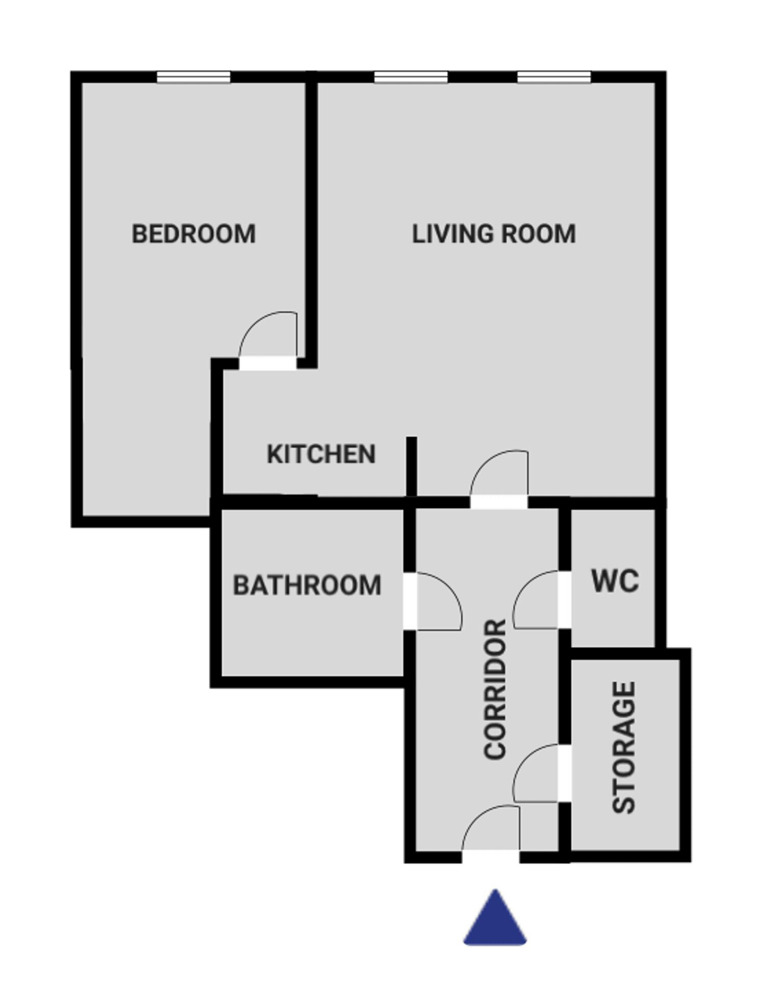Grundriss mit Schlafzimmer, Wohnzimmer, Küche, Bad, WC, Stauraum und einem Flur.