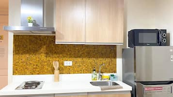 Fridge, microwave, electric kettle, dining tables