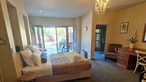 A bedroom with a bed, a desk, a chair, a fan, and a view of the outdoors. - Find your stay peaceful and comfortable with luxury. Kids friendly (Scarborough)