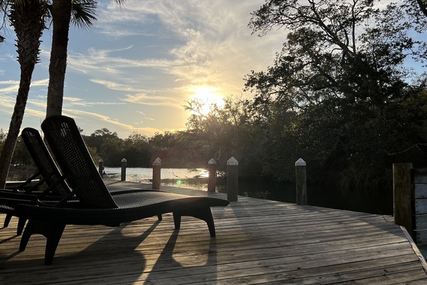 Peaceful views! Uncovered deck space with 2 loungers in front of unit.