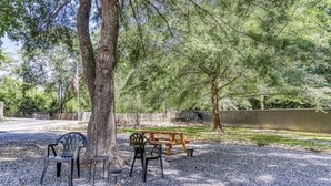 A park with picnic tables, benches, and chairs. - 9 on the Ridge - 3 miles from Dollywood & Pet Friendly - Many repeat customers! (Pigeon Forge)