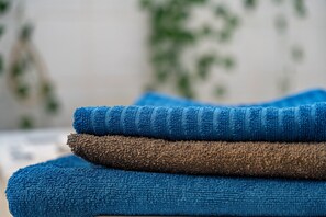 A stack of towels with a blurred background.