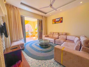Appartement Deluxe | Coin séjour | TV connectée, services de streaming
