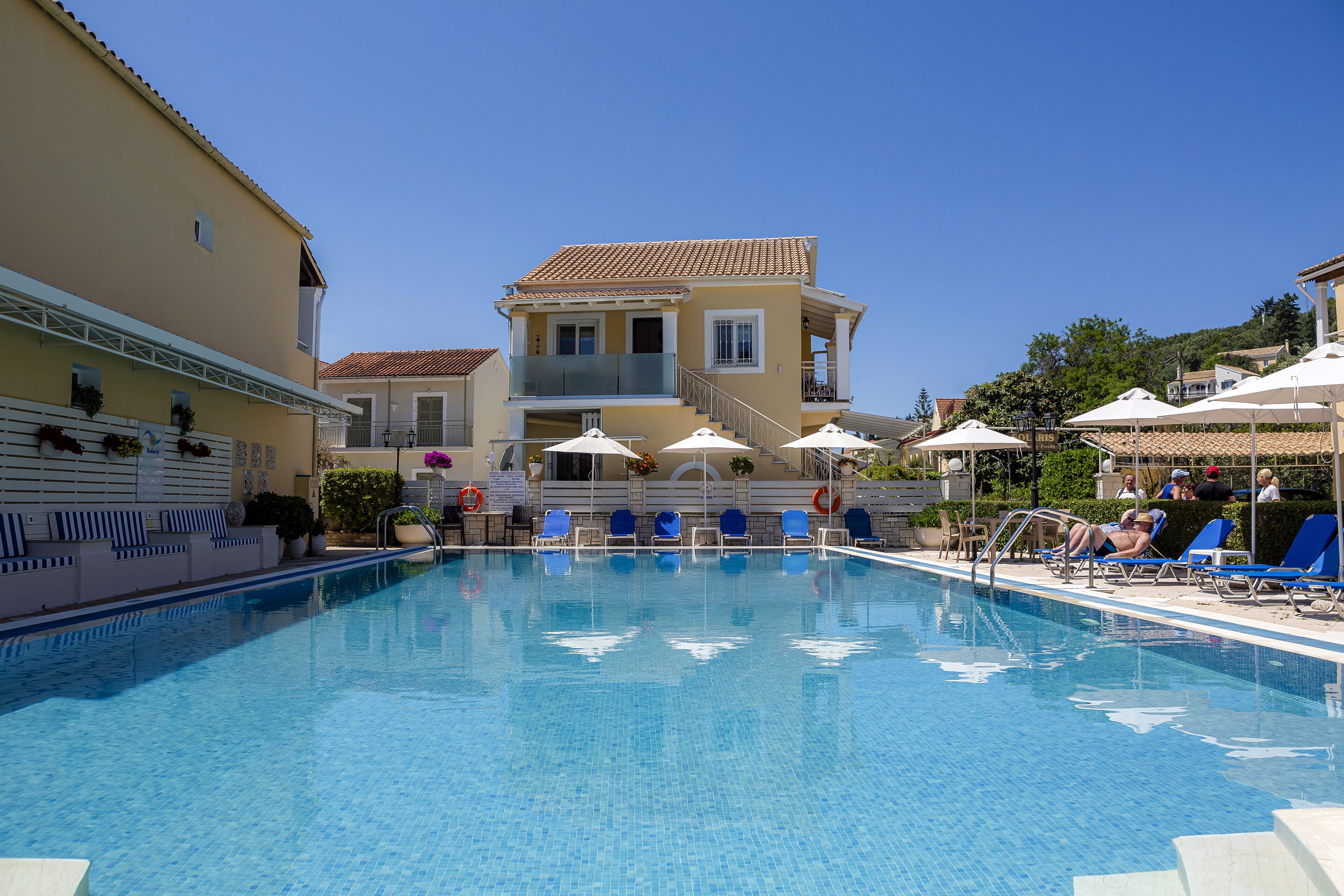 Seasonal outdoor pool, open 9:00 AM to 7:00 PM, pool umbrellas