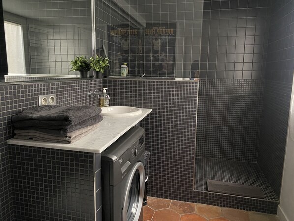 Shower, hair dryer, towels, soap