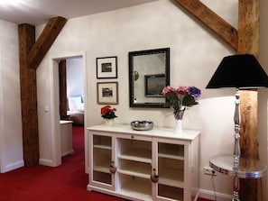 Experience the perfect blend of modern and traditional charm in this inviting room, featuring a cozy bed and functional lighting.