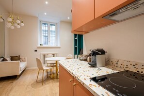 Fridge, stovetop, coffee/tea maker, cookware/dishes/utensils