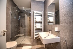 Shower, hair dryer, towels, soap - SOUK 32 - Minimalist Luxury One-Bedroom Apartments on Soukenická  (Hlavní mesto Praha)