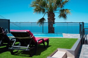 Outdoor pool, pool umbrellas, pool loungers