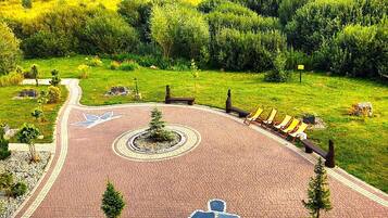 Habitación cuádruple panorámica, 1 habitación, balcón | Vista al jardín