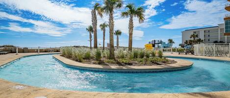 Float around on the lazy river surrounded by palm trees, with fun waterslides and beach access just steps away