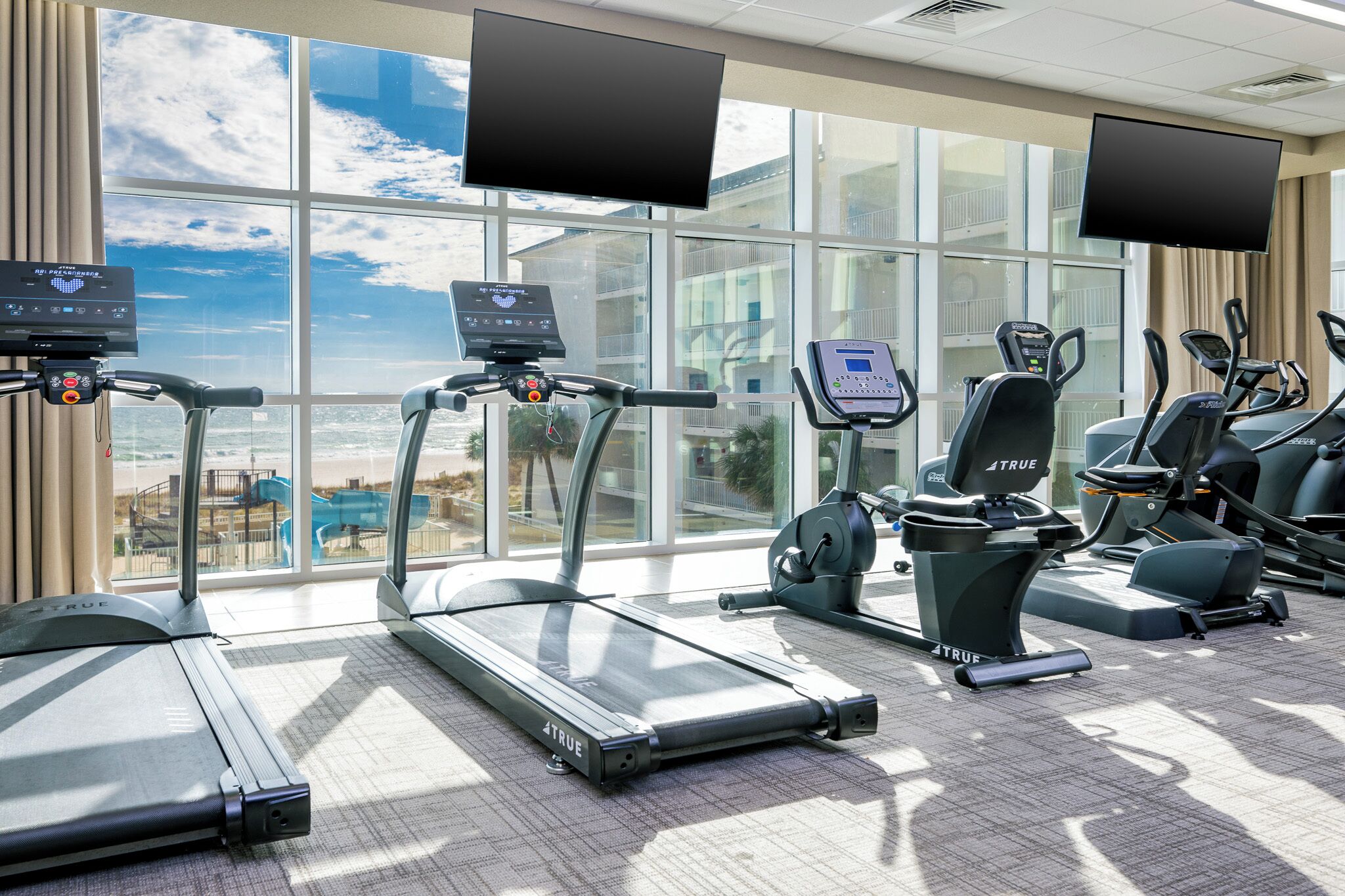 Stay active in the fitness centers with stunning views of the beach while you work out on modern equipment