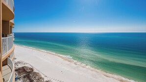 A beachfront hotel with a clear view of the ocean and a sandy beach. - Gorgeous Beach Retreat at Phoenix Gulf Towers (Orange Beach)