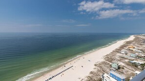 Relax on the beach with ocean views and comfortable sun loungers.