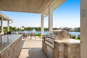 Outdoor dining - Millville by the Sea three-story home with resort amenities & screened patio (Millville)