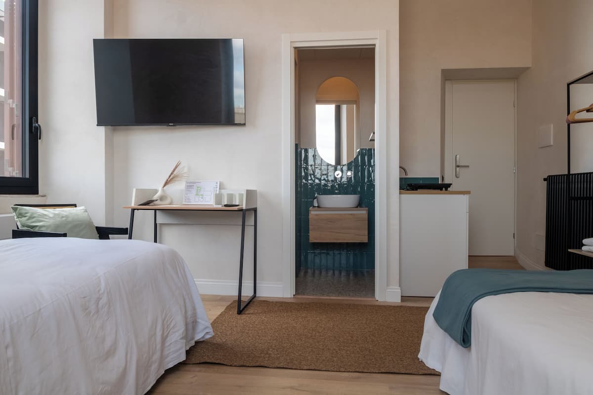 Habitació quàdruple Comfort | Llençols italians de la marca Frette i roba de llit d'alta qualitat