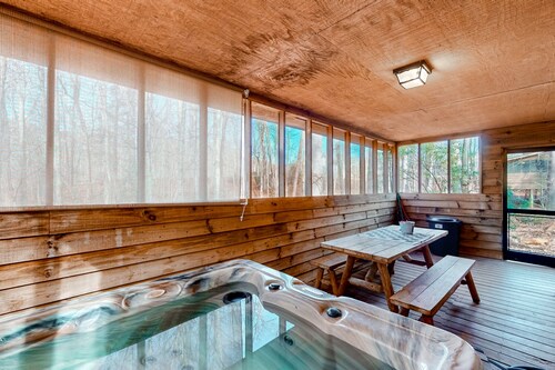Dog-friendly cabin with private hot tub, wood fireplace, firepit, & washer/dryer