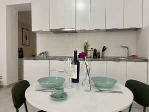 Fridge, stovetop, coffee/tea maker, cookware/dishes/utensils