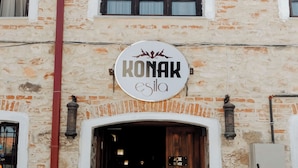 A building with a sign reading "KONAK esila" above the entrance.