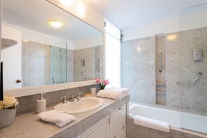 Shower, hair dryer, towels, soap