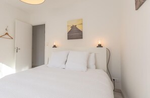 Iron/ironing board, travel crib, free WiFi, bed sheets