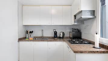 Fridge, microwave, stovetop, coffee/tea maker