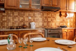Fridge, microwave, oven, stovetop - Apartment 'A The City House' with Private Terrace, Balcony and Air Conditioning (TINOS CYCLADES)