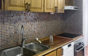 Fridge, stovetop, dishwasher, coffee/tea maker