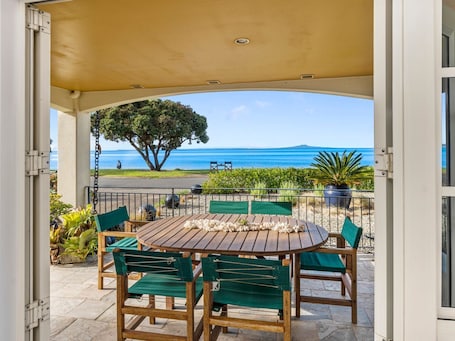 Outdoor dining. Stay and Relax at Beachfront Beauty