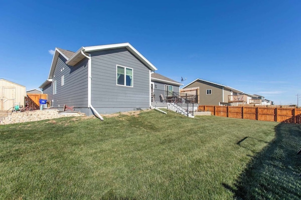 Large backyard with view of the deck. Shed is locked and not accessible during guests stay.