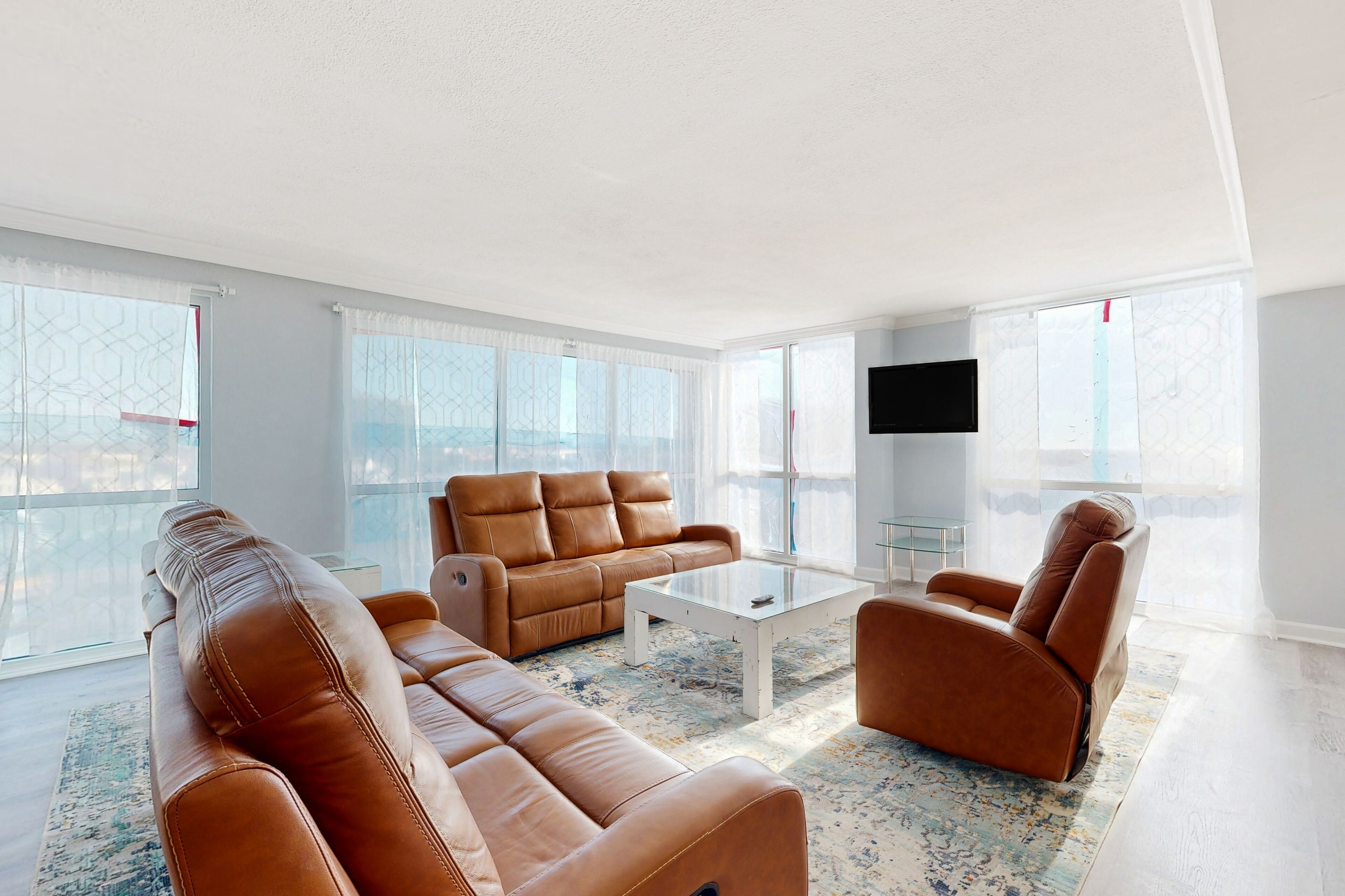Sunny beachfront condo with pool, sauna, tennis, gym, & central AC