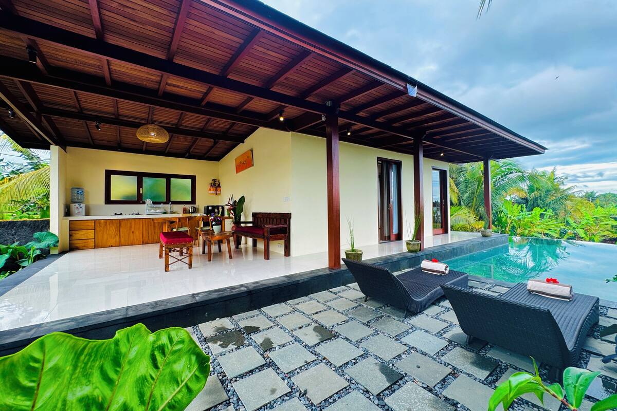 Deluxe Villa, 1 Bedroom, Kitchen, Pool View | Living area | 60-inch Smart TV with cable channels