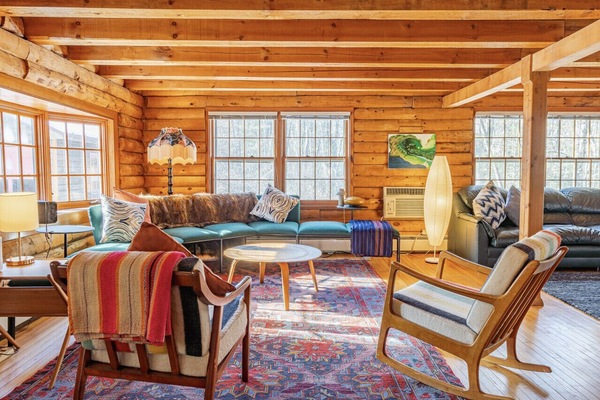 This sofa and chairs are parallel to the indoor wood stove