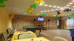 A room with a pool table, a foosball table, and a television screen. - Four -anniversary Type B (Dzwirzyno)