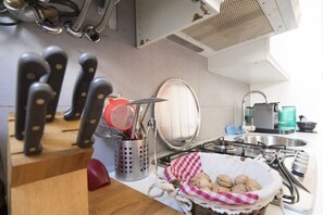 Fridge, stovetop, coffee/tea maker, cookware/dishes/utensils